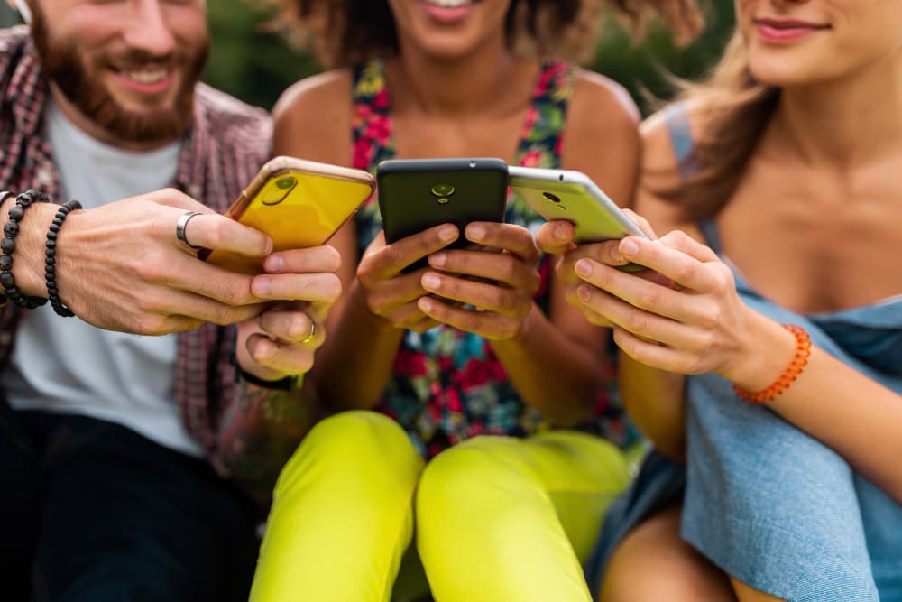 Team members receiving digital business cards on their phones