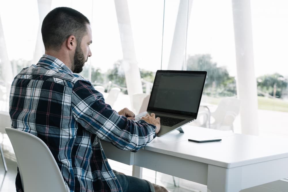 Team configuring brand settings on a laptop